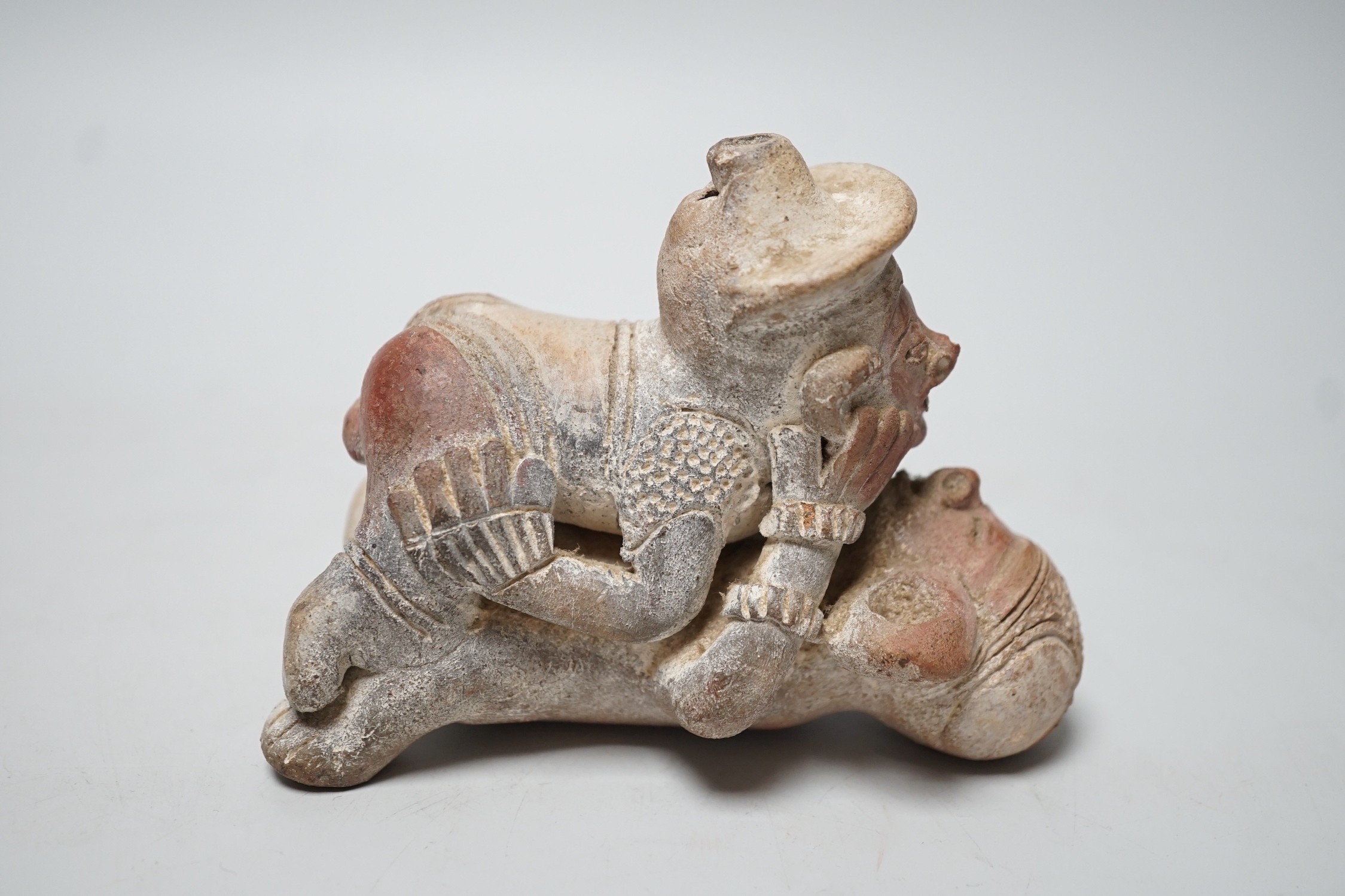 A Mayan or later biscuit earthenware erotic novelty whistle, 12cm long